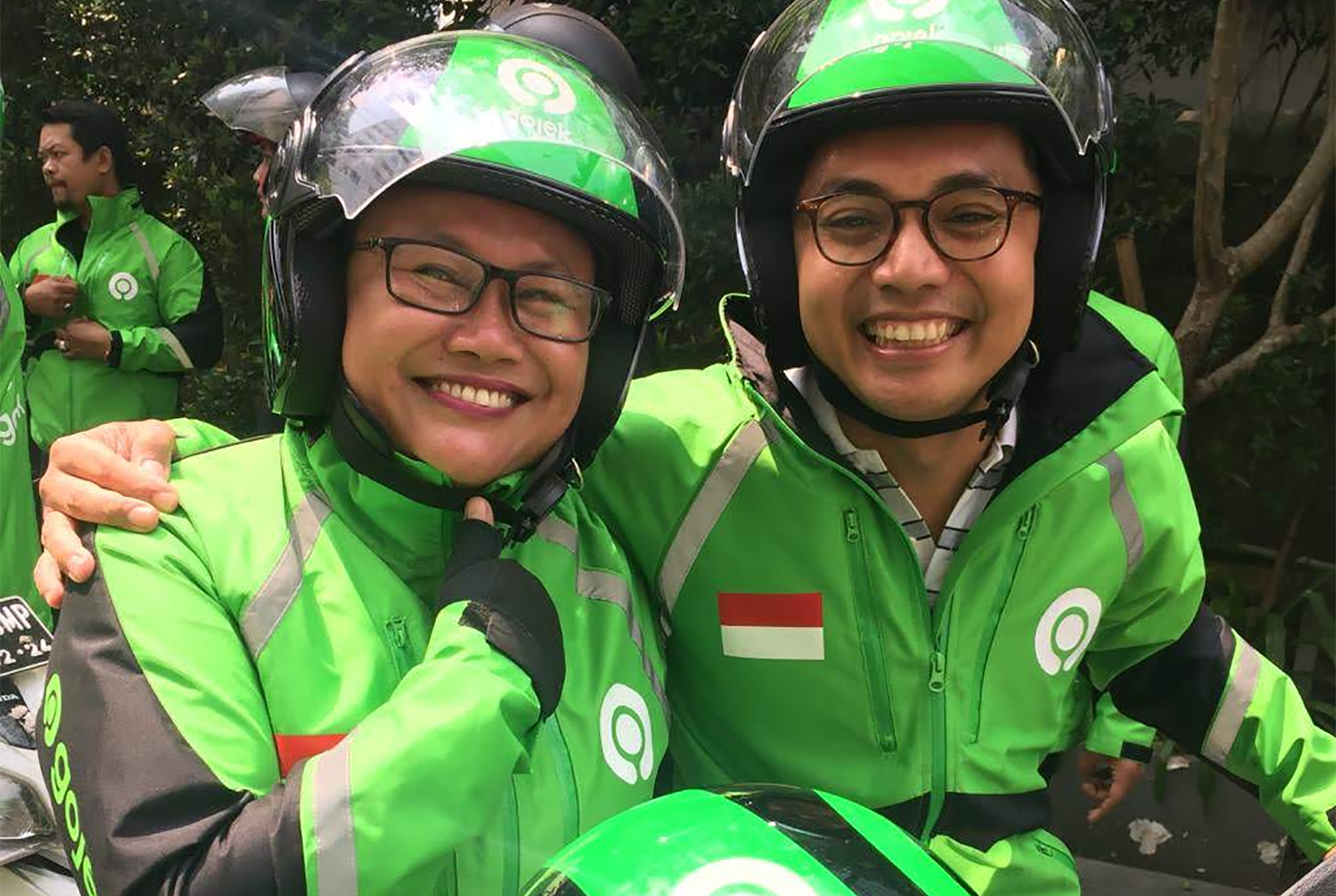 Aldi in full Gojek uniform with a Gojek driver.